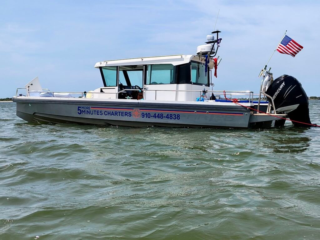 5 More Minutes Charters Boat on the Water